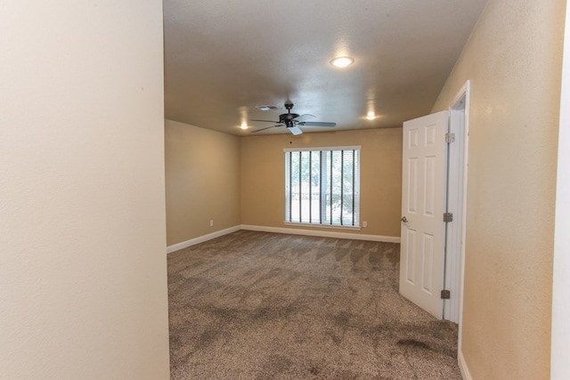 carpeted empty room with ceiling fan