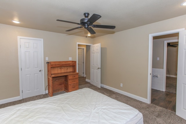 bedroom featuring a textured ceiling, dark hardwood / wood-style flooring, and ceiling fan