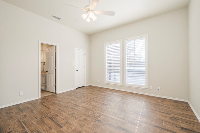 interior space with dark wood-type flooring and ceiling fan