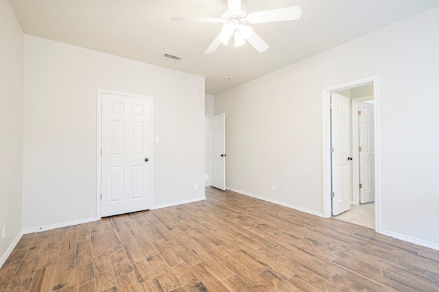 unfurnished room featuring ceiling fan and light hardwood / wood-style floors