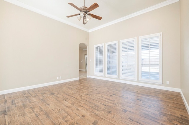 unfurnished room featuring wood-type flooring, ornamental molding, and ceiling fan