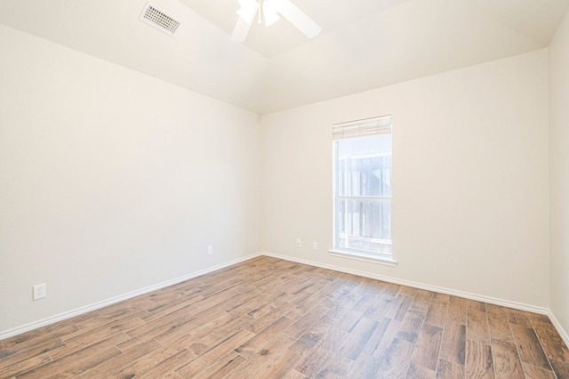 unfurnished room with ceiling fan and hardwood / wood-style floors