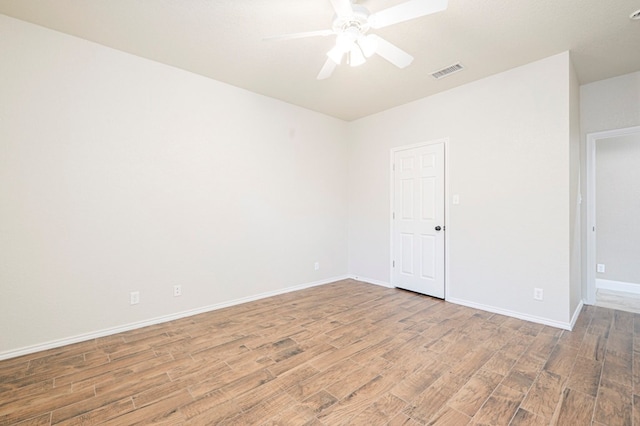 empty room with wood-type flooring and ceiling fan