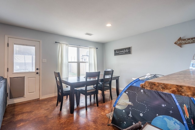 dining space with baseboards, recessed lighting, finished concrete floors, and visible vents