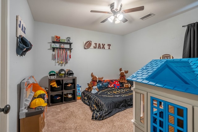 bedroom with visible vents, carpet flooring, and ceiling fan