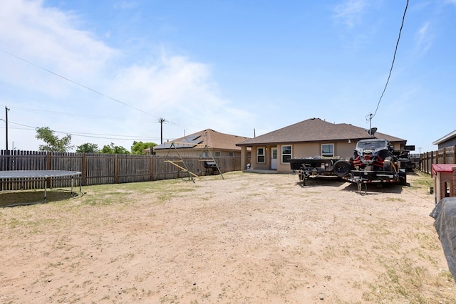 1004 Jefferson St, Odessa, TX 79761 - fenced backyard featuring a trampoline