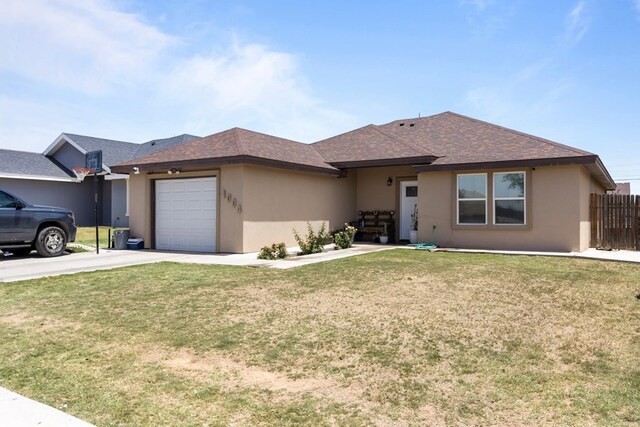 1004 Jefferson St, Odessa, TX 79761 - view of front of house with driveway, a garage, stucco siding, and a shingled roof