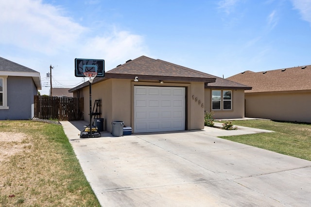 1004 Jefferson St, Odessa, TX 79761 - view of front of home featuring concrete driveway, an attached garage, stucco siding, and roof with shingles