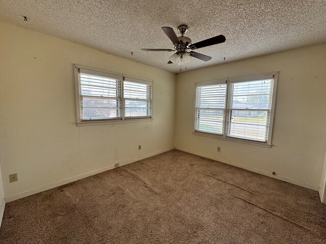 2203 40th St, Snyder, TX 79549 - spare room with carpet floors, a textured ceiling, ceiling fan, and baseboards