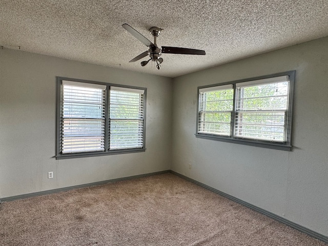 2203 40th St, Snyder, TX 79549 - carpeted spare room featuring ceiling fan, a textured ceiling, and baseboards