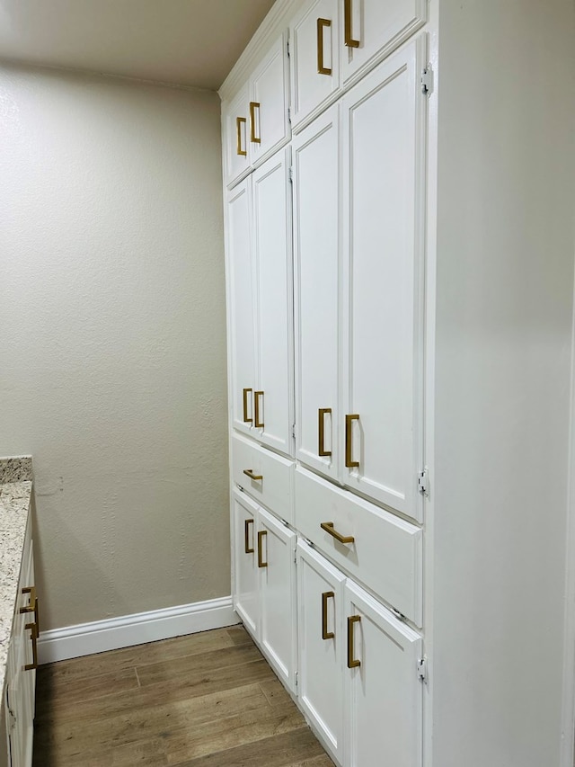 interior details featuring hardwood / wood-style flooring