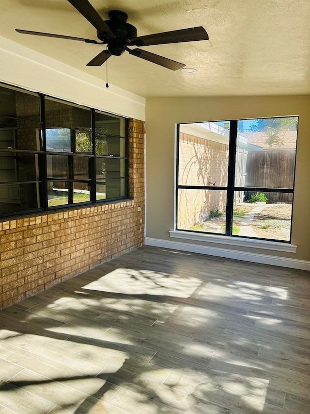 view of patio featuring ceiling fan