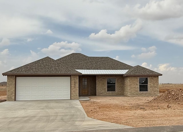 13211 E County Rd 110, Midland, TX 79706 - ranch-style home with concrete driveway, brick siding, an attached garage, and a shingled roof