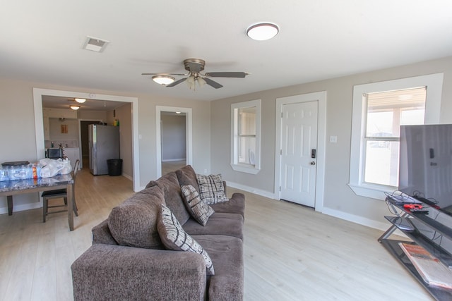 2101 Grace St, Big Spring, TX 79720 - living room with light wood finished floors and ceiling fan