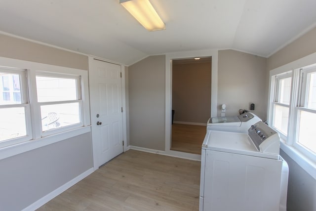 2101 Grace St, Big Spring, TX 79720 - laundry area with separate washer and dryer, light wood-style flooring, and plenty of natural light