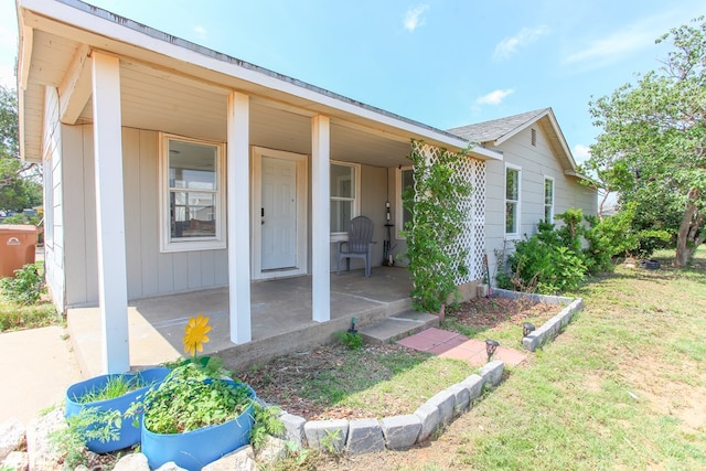 2101 Grace St, Big Spring, TX 79720 - view of front of home with a porch and a front lawn