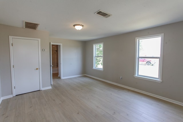 2101 Grace St, Big Spring, TX 79720 - empty room with baseboards and light wood finished floors