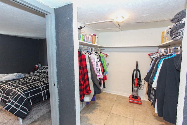 2101 Grace St, Big Spring, TX 79720 - spacious closet with tile patterned flooring and attic access