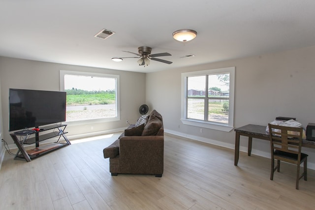 2101 Grace St, Big Spring, TX 79720 - living area featuring light wood-style flooring and a ceiling fan