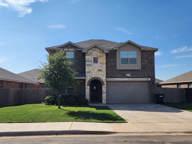 view of front of property featuring brick siding, fence, a front yard, stone siding, and driveway