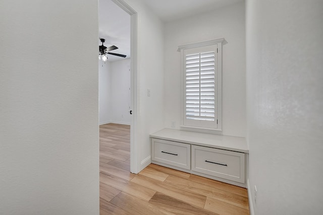 mudroom with baseboards, light wood-style flooring, and a ceiling fan