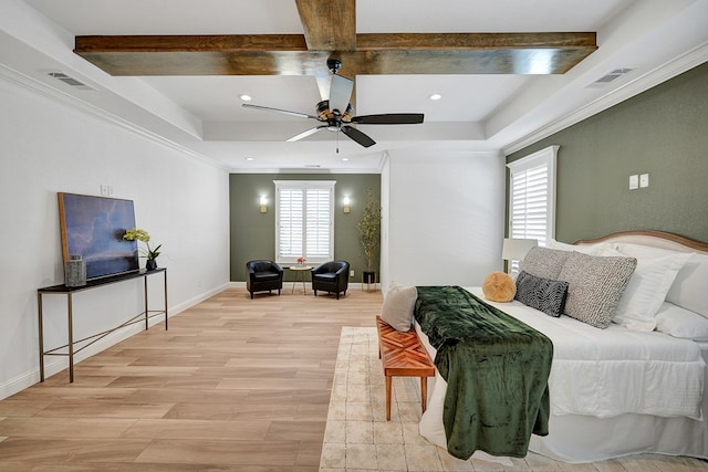 bedroom featuring baseboards, crown molding, visible vents, and light wood-style floors