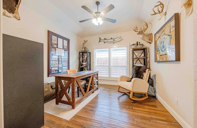 office area featuring baseboards, wood finished floors, and a ceiling fan