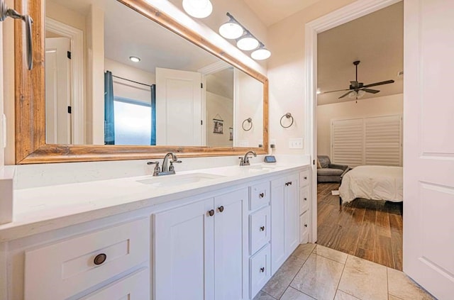 1202 Stonefield Dr, Midland, TX 79706 - ensuite bathroom with a ceiling fan and double vanity