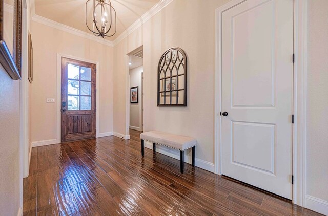 1202 Stonefield Dr, Midland, TX 79706 - foyer entrance featuring crown molding, a chandelier, dark wood-style floors, and baseboards