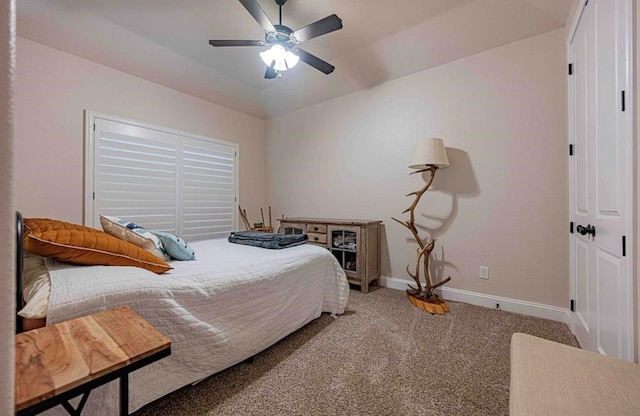 carpeted bedroom with baseboards and a ceiling fan