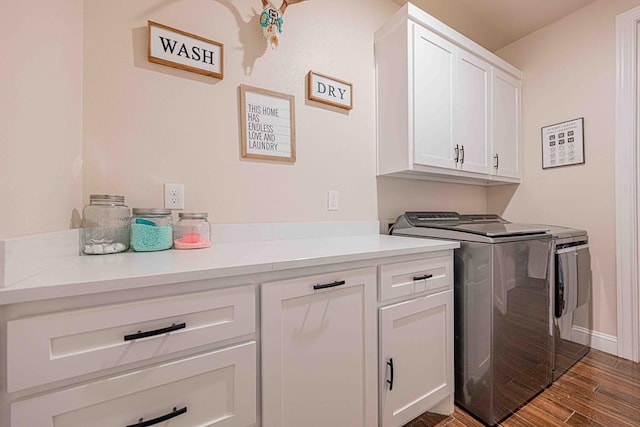 1202 Stonefield Dr, Midland, TX 79706 - laundry area featuring washer and clothes dryer, cabinet space, wood finished floors, and baseboards