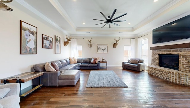 1202 Stonefield Dr, Midland, TX 79706 - living room with healthy amount of natural light, a raised ceiling, hardwood / wood-style floors, a ceiling fan, and ornamental molding