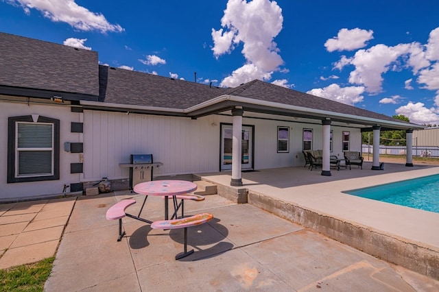 back of house with a patio area and a fenced in pool