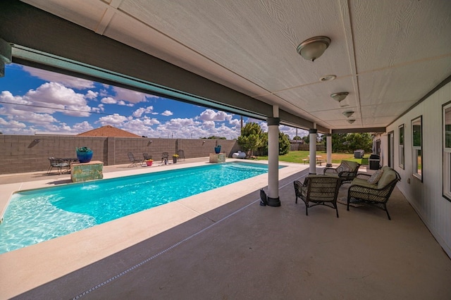 view of swimming pool featuring a patio