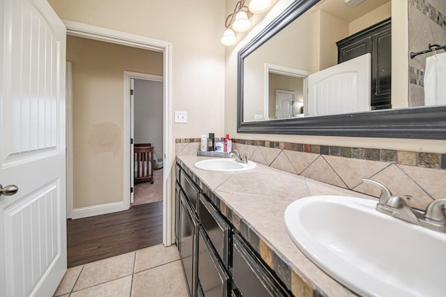 bathroom featuring tile patterned flooring and vanity