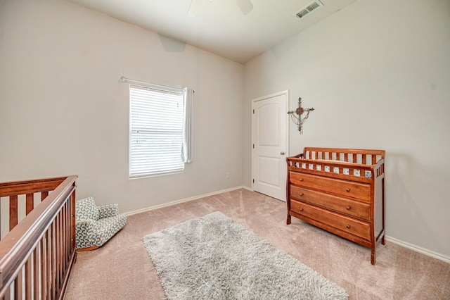 carpeted bedroom featuring ceiling fan and vaulted ceiling