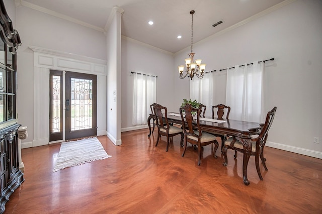 dining room featuring a towering ceiling, an inviting chandelier, and ornamental molding