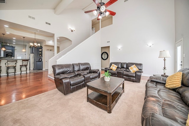 living room featuring high vaulted ceiling, carpet, and beam ceiling