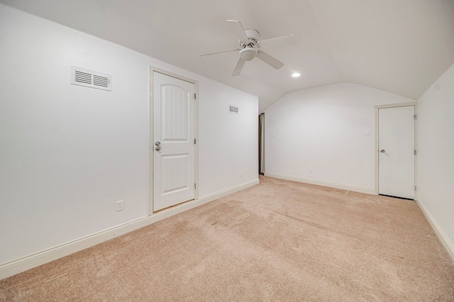 bonus room with light carpet, vaulted ceiling, and ceiling fan