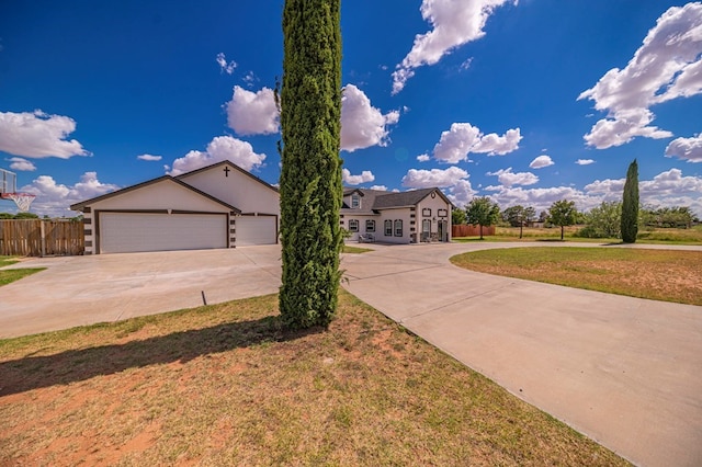 view of front of house with a front lawn and a garage