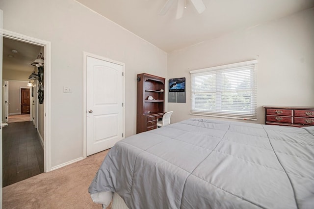 bedroom featuring ceiling fan, a closet, and carpet floors