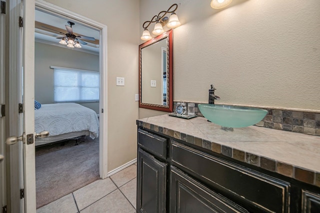 bathroom with ceiling fan, vanity, tile patterned flooring, and crown molding