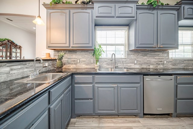 kitchen with gray cabinetry, pendant lighting, dishwasher, and sink