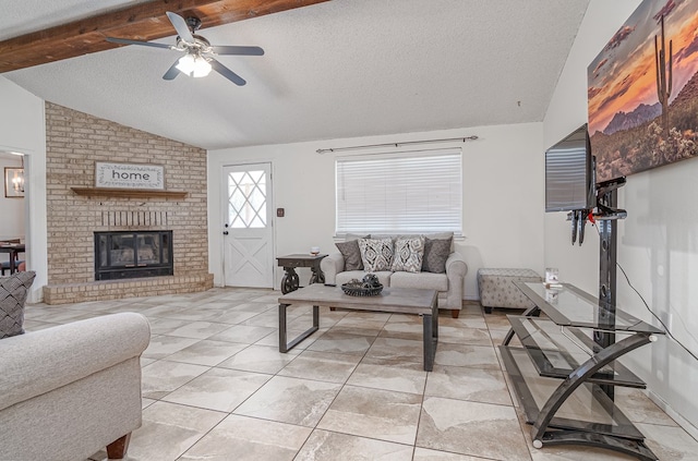 1604 Mcdonald St, Midland, TX 79703 - living room with a textured ceiling, ceiling fan, and a fireplace