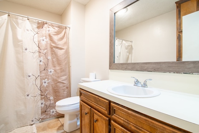 1604 Mcdonald St, Midland, TX 79703 - bathroom with vanity, a textured ceiling, tile patterned flooring, and a shower with curtain