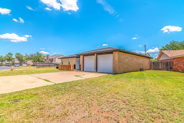 1604 Mcdonald St, Midland, TX 79703 - view of side of home with brick siding and a garage