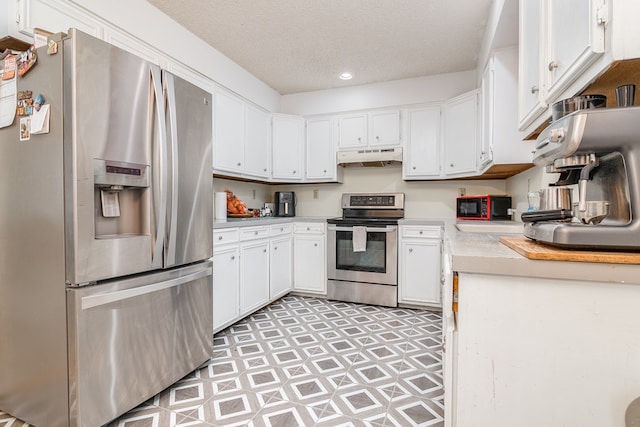 1604 Mcdonald St, Midland, TX 79703 - kitchen featuring stainless steel appliances, light countertops, light flooring, under cabinet range hood, and white cabinetry