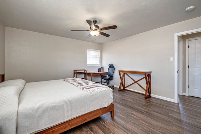 bedroom featuring baseboards, a ceiling fan, and wood finished floors