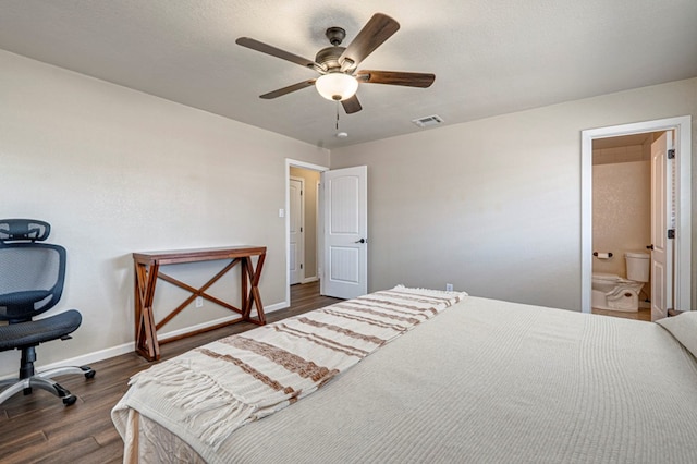 bedroom with ceiling fan, dark wood-style flooring, visible vents, baseboards, and ensuite bathroom
