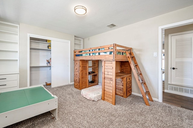 carpeted bedroom with baseboards and visible vents